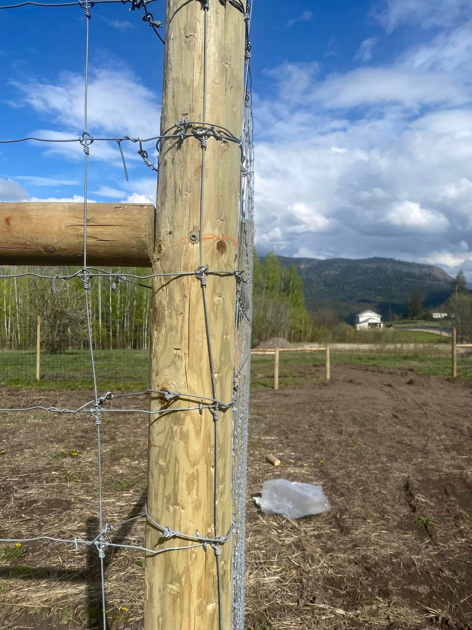 Fencing straight across the ranch to the centimeters